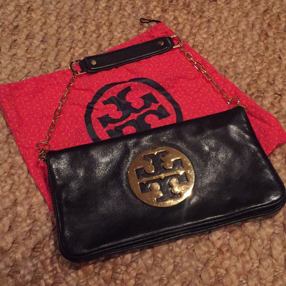 Tory Burch black shoulder bag of clutch.